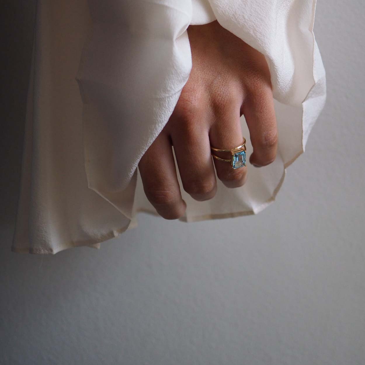 Emerald-Cut Aquamarine Ring by Bianca Jones Jewellery, London: aquamarine set on two handcrafted yellow gold bands.