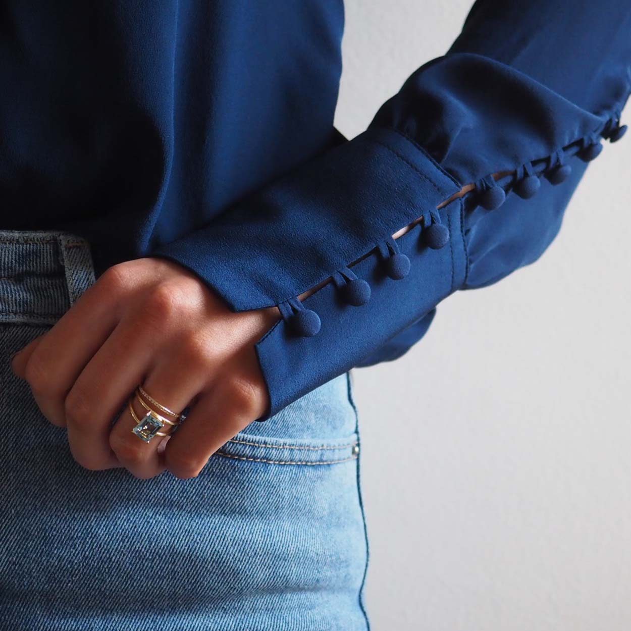 Bridal Emerald-Cut Aquamarine Ring by Bianca Jones Jewellery, London: Joyful aquamarine set on two handcrafted yellow gold bands.