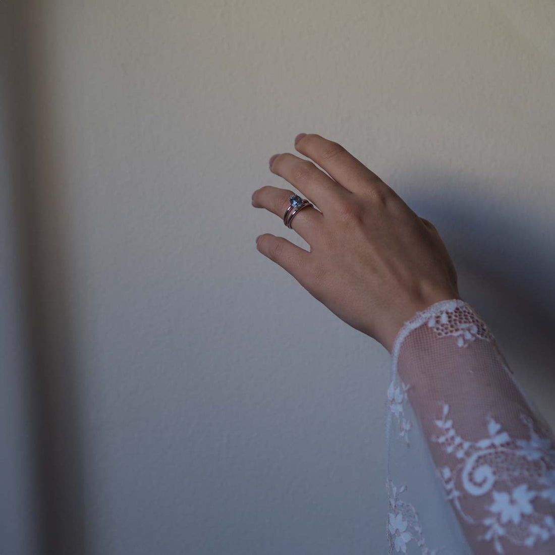 Handmade Oval Aquamarine Ring from Bianca Jones Jewellery, London. Showcases an oval aquamarine stone set atop two white gold bands