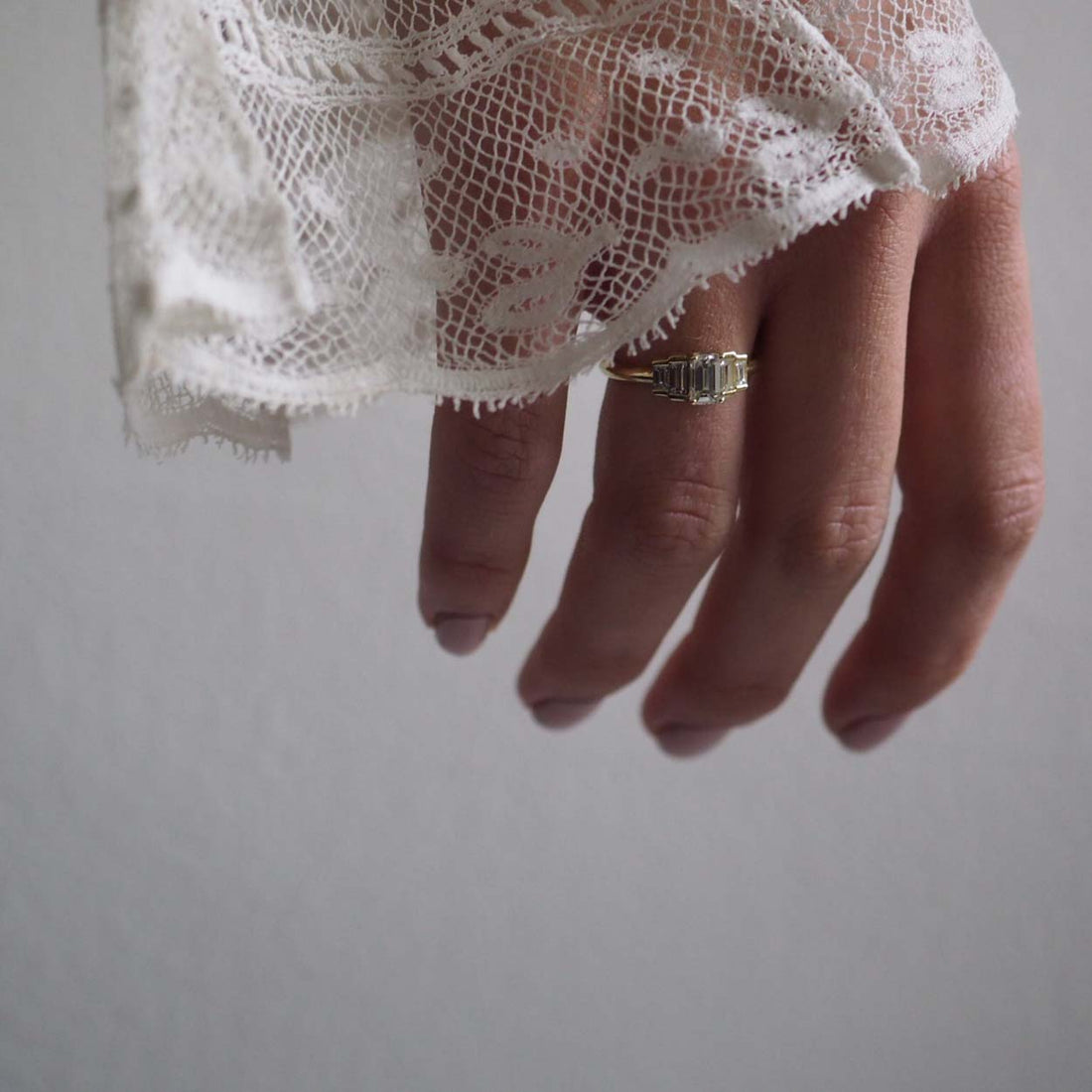 Bianca Jones Art Deco Vintage Diamond Engagement Ring in Recycled Yellow Gold with Emerald-Cut Diamond, Baguette Accents, and Secret Heart Detail.