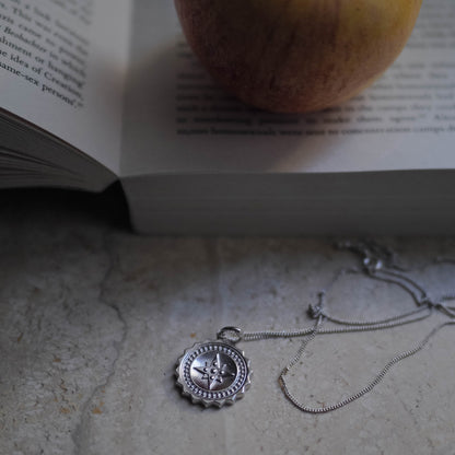 Bianca Jones large compass necklace available in silver or gold vermeil, featuring intricate design details, ideal for explorers and adventurers