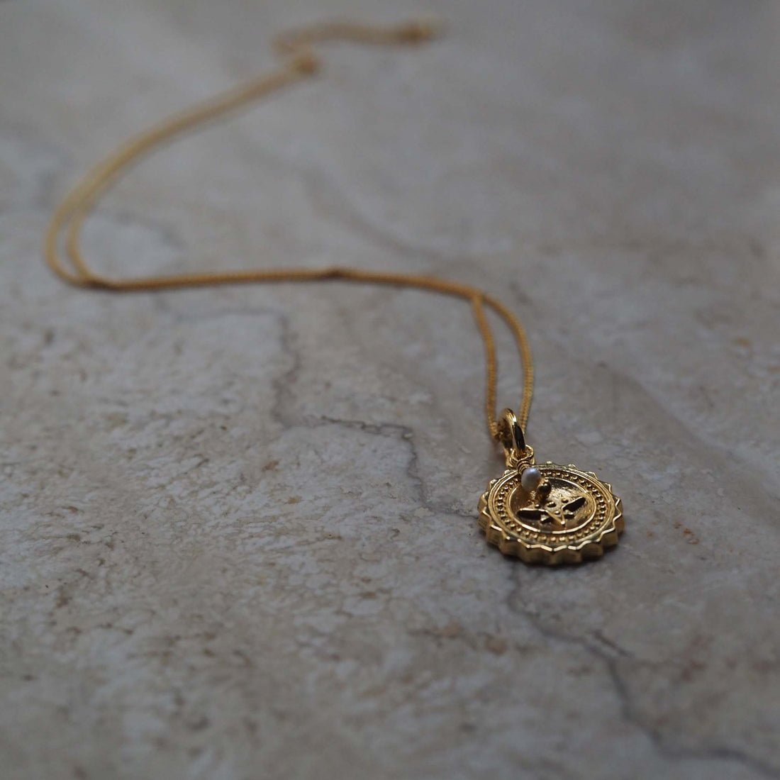 Compass Necklace with Pearl: Symbolises guidance, wisdom, and purity, inspiring confidence and adventure in embracing the unknown.