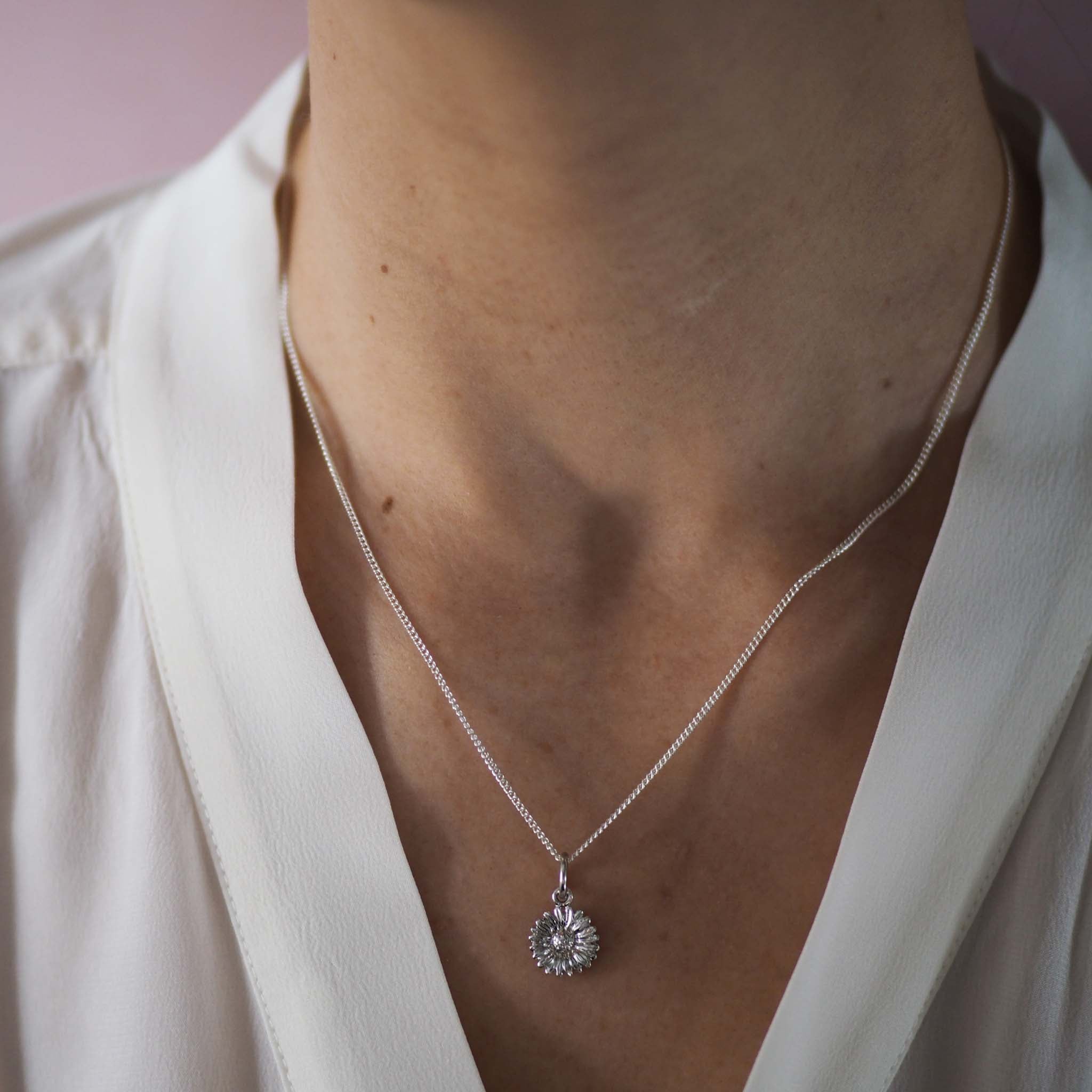 Bianca Jones daisy necklace available in silver or gold vermeil, symbolising innocence and new beginnings