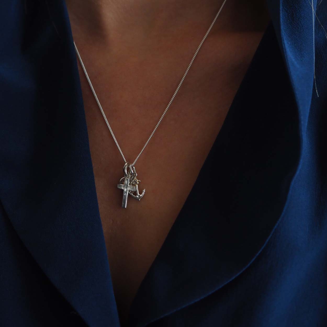 Faith, Hope, and Charity Necklace with heart, anchor, and cross symbols, intricately designed to represent love, hope, and protection.