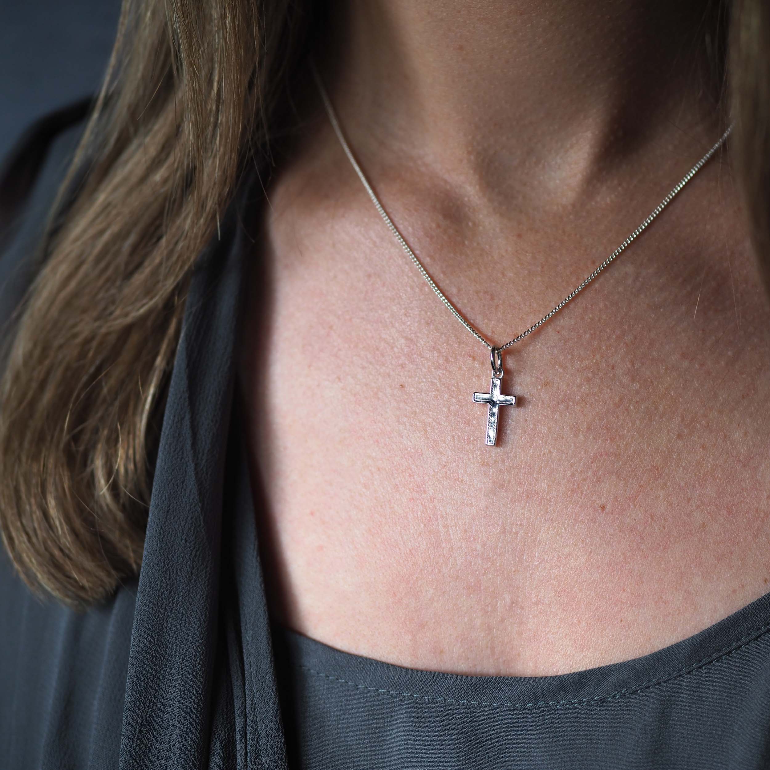 Sterling silver cross necklace handcrafted in recycled silver. A meaningful pendant symbolising faith, protection, and quiet strength.