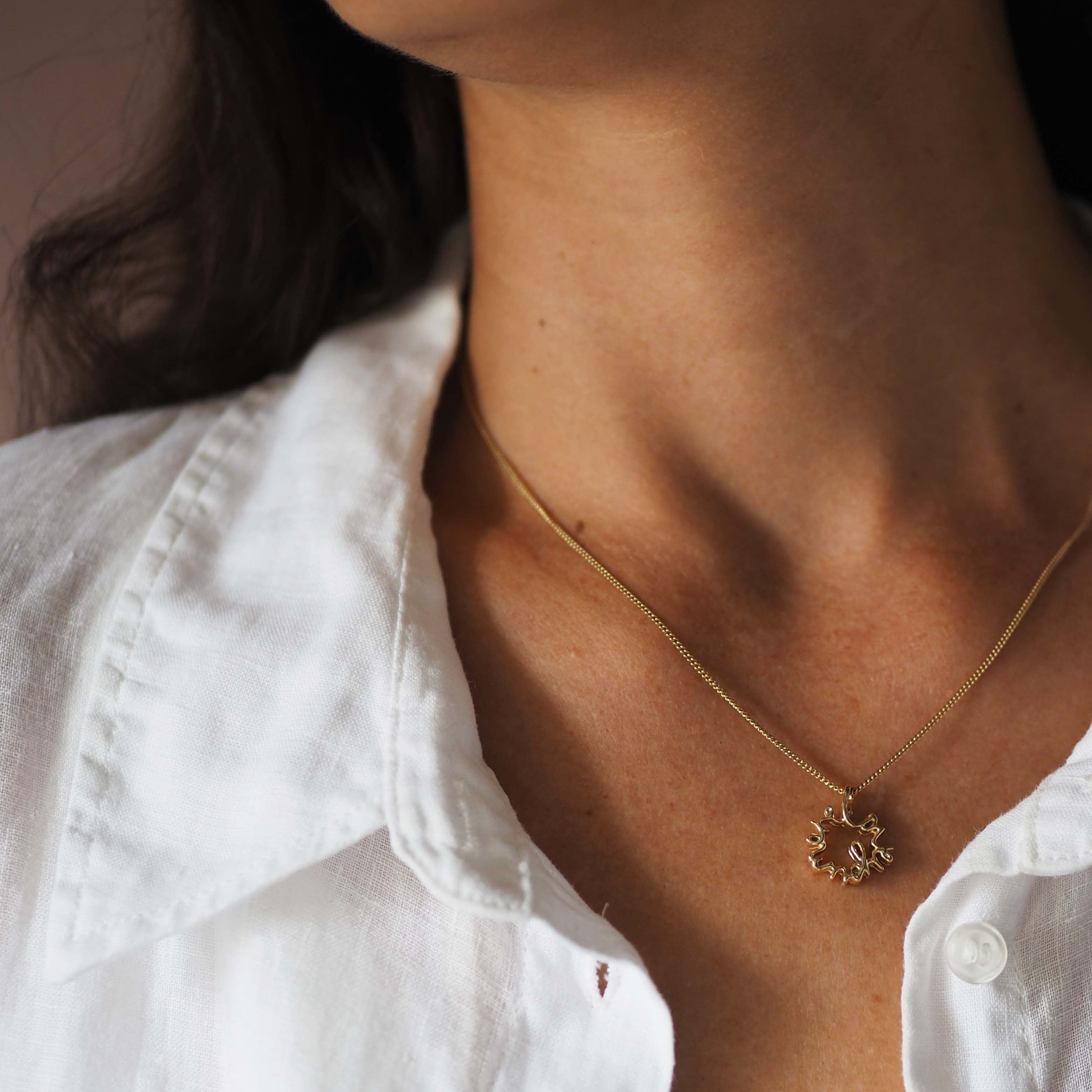 Love You More Petite Necklace in solid yellow, white, or rose gold — delicate gold pendant symbolising deep love and connection, handcrafted in London.