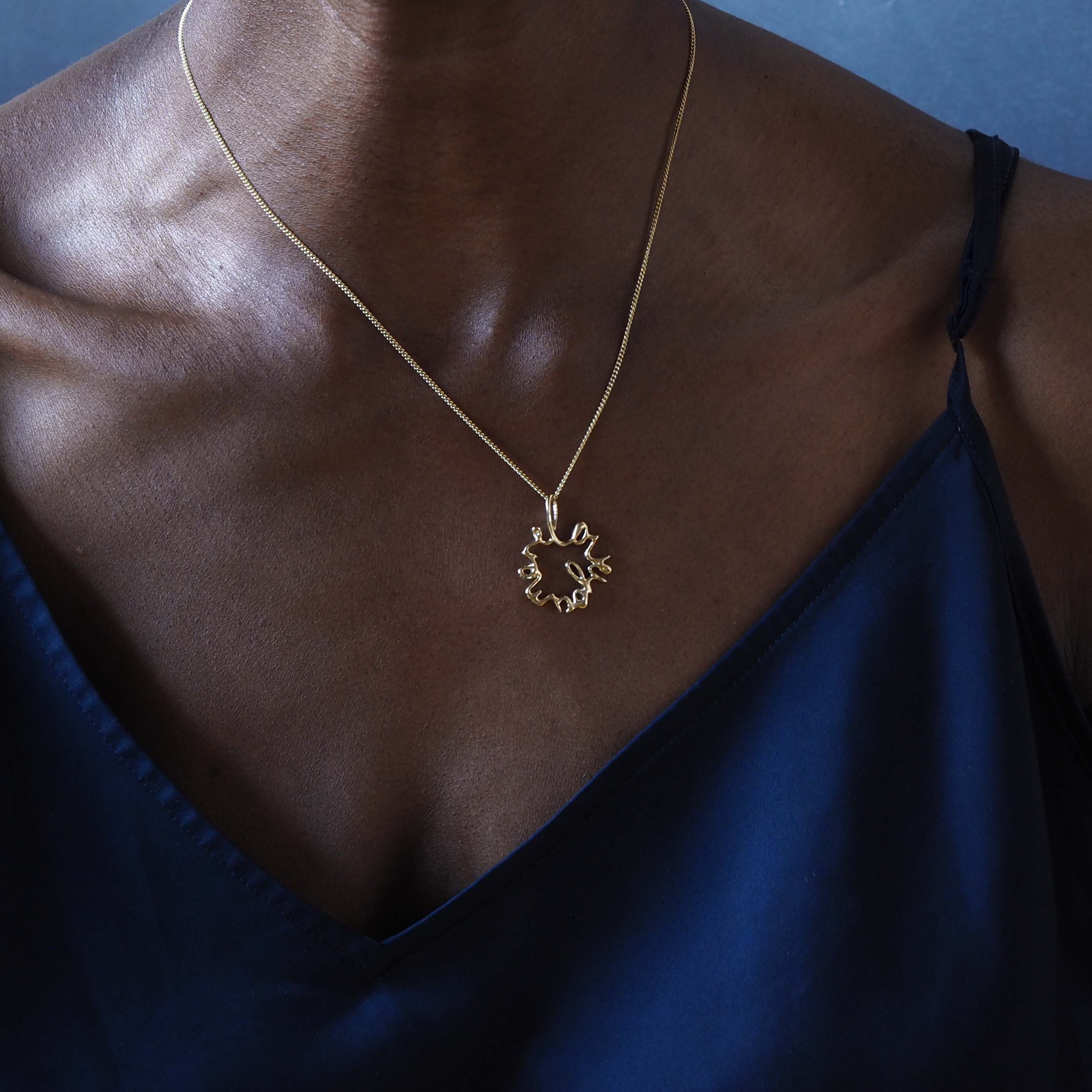Solid gold Statement Love You More Necklace — a sculptural, heartfelt piece inspired by lasting love and deep connection.