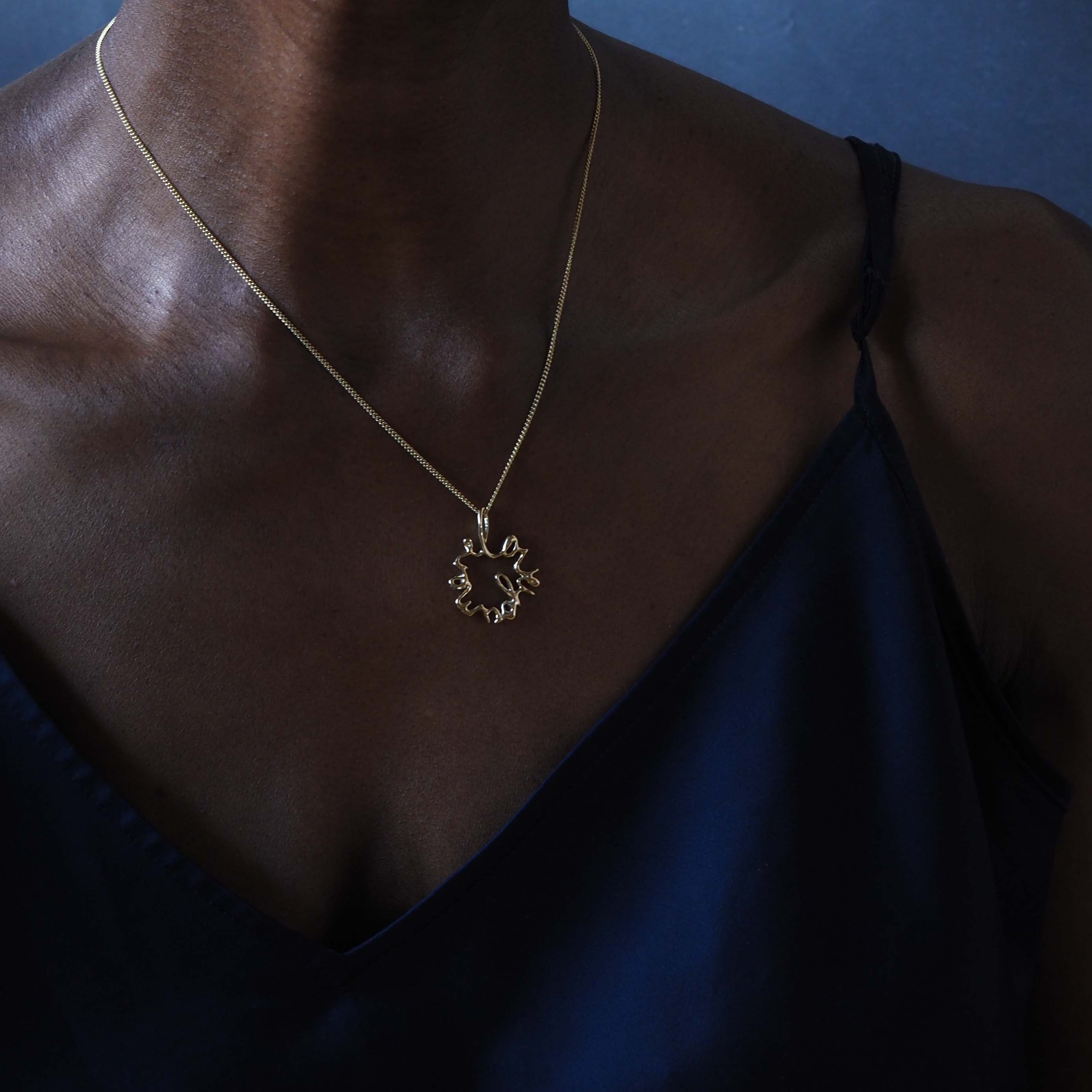 Solid gold Statement Love You More Necklace — a sculptural, heartfelt piece inspired by lasting love and deep connection.