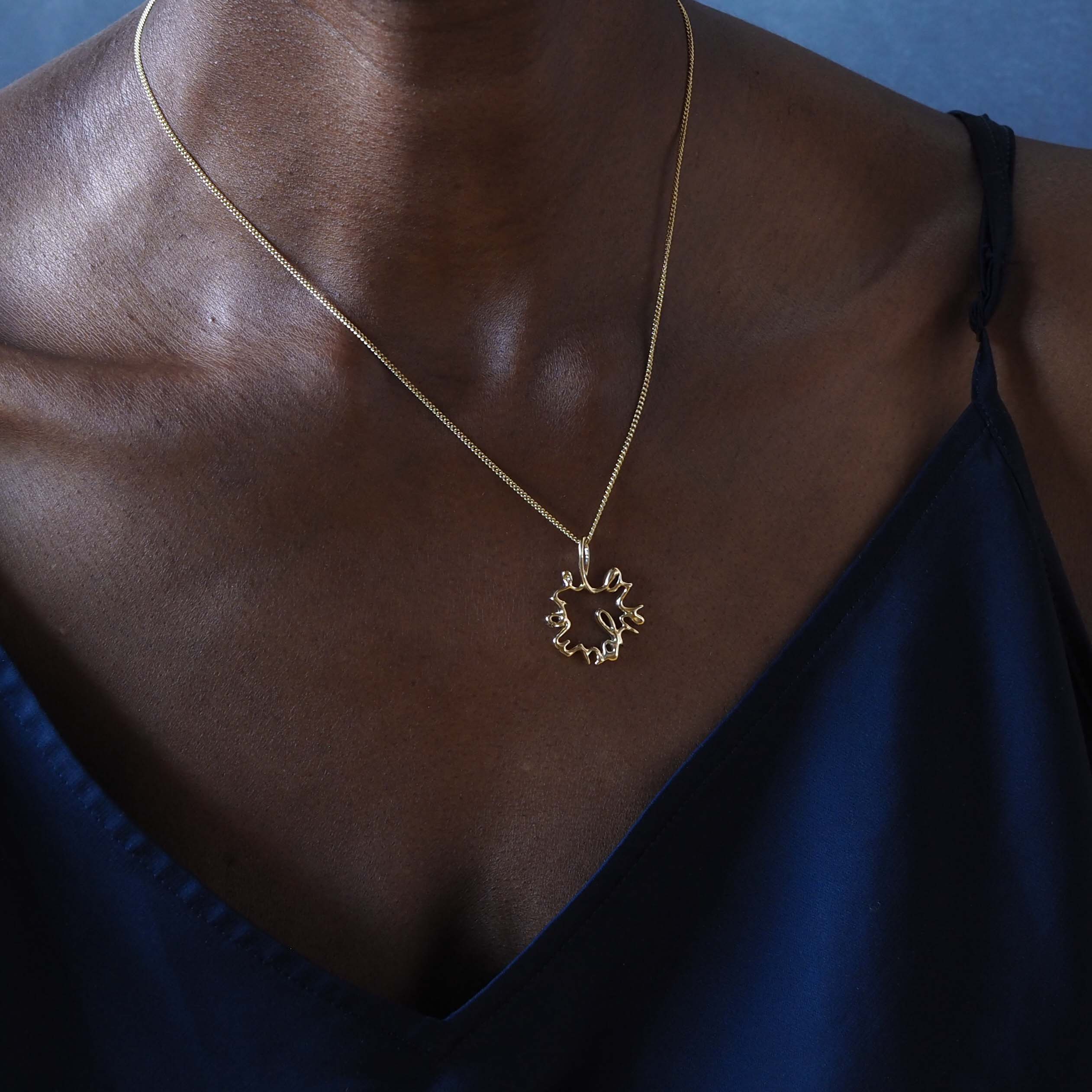Solid gold Statement Love You More Necklace — a sculptural, heartfelt piece inspired by lasting love and deep connection.