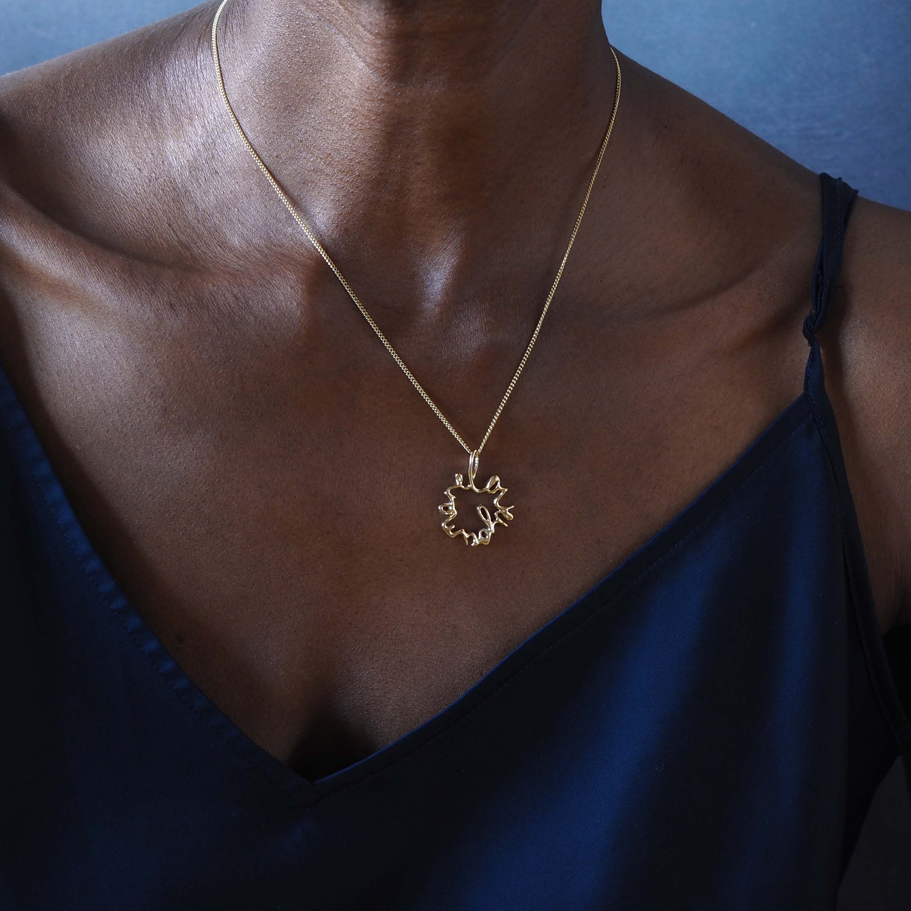 Solid gold Statement Love You More Necklace — a sculptural, heartfelt piece inspired by lasting love and deep connection.