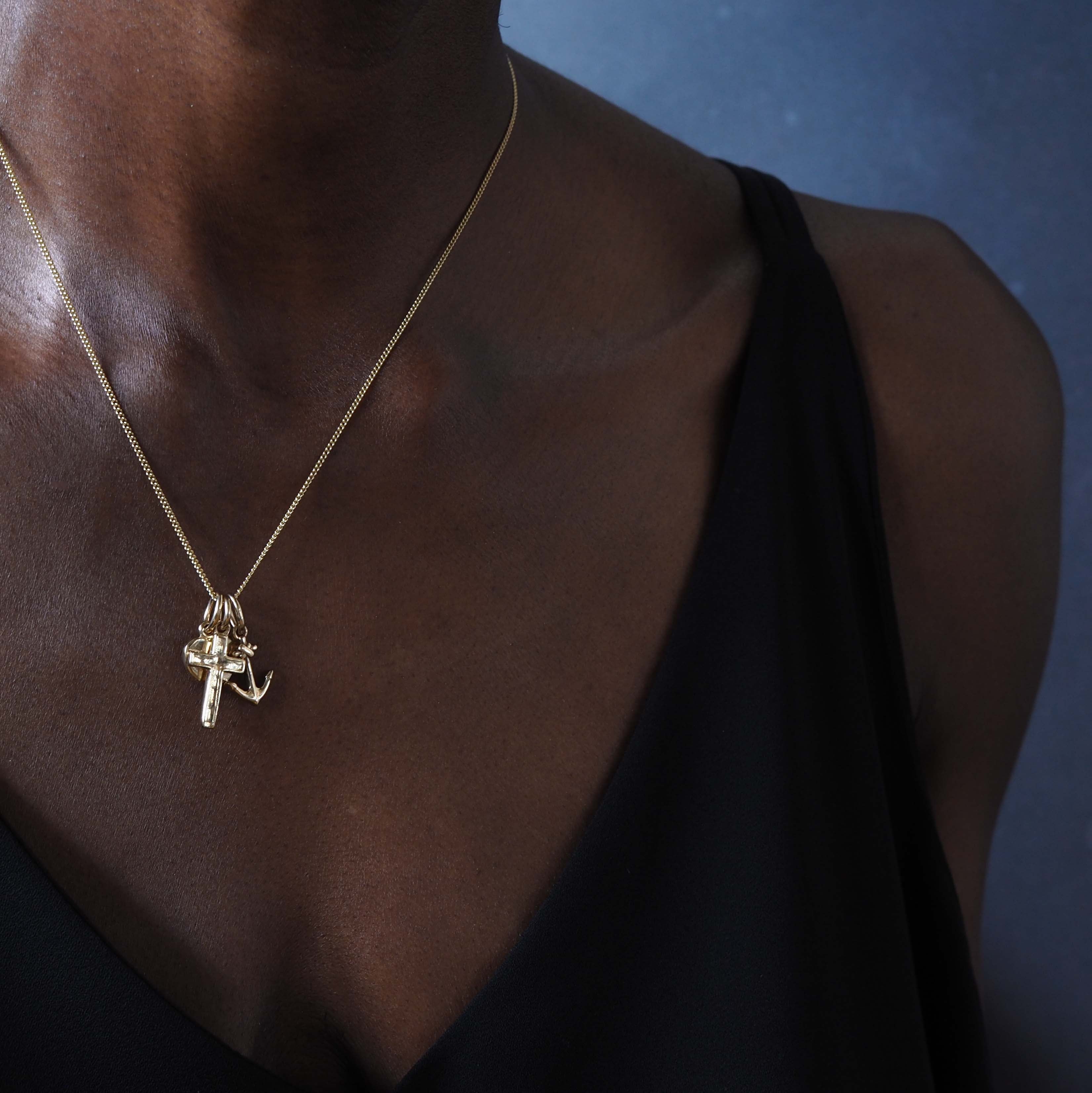 Faith, Hope, and Charity Necklace in solid 9ct gold, showcasing a heart, anchor, and cross charm. Available in Yellow, White, or Rose Gold, symbolising love, hope, and protection.