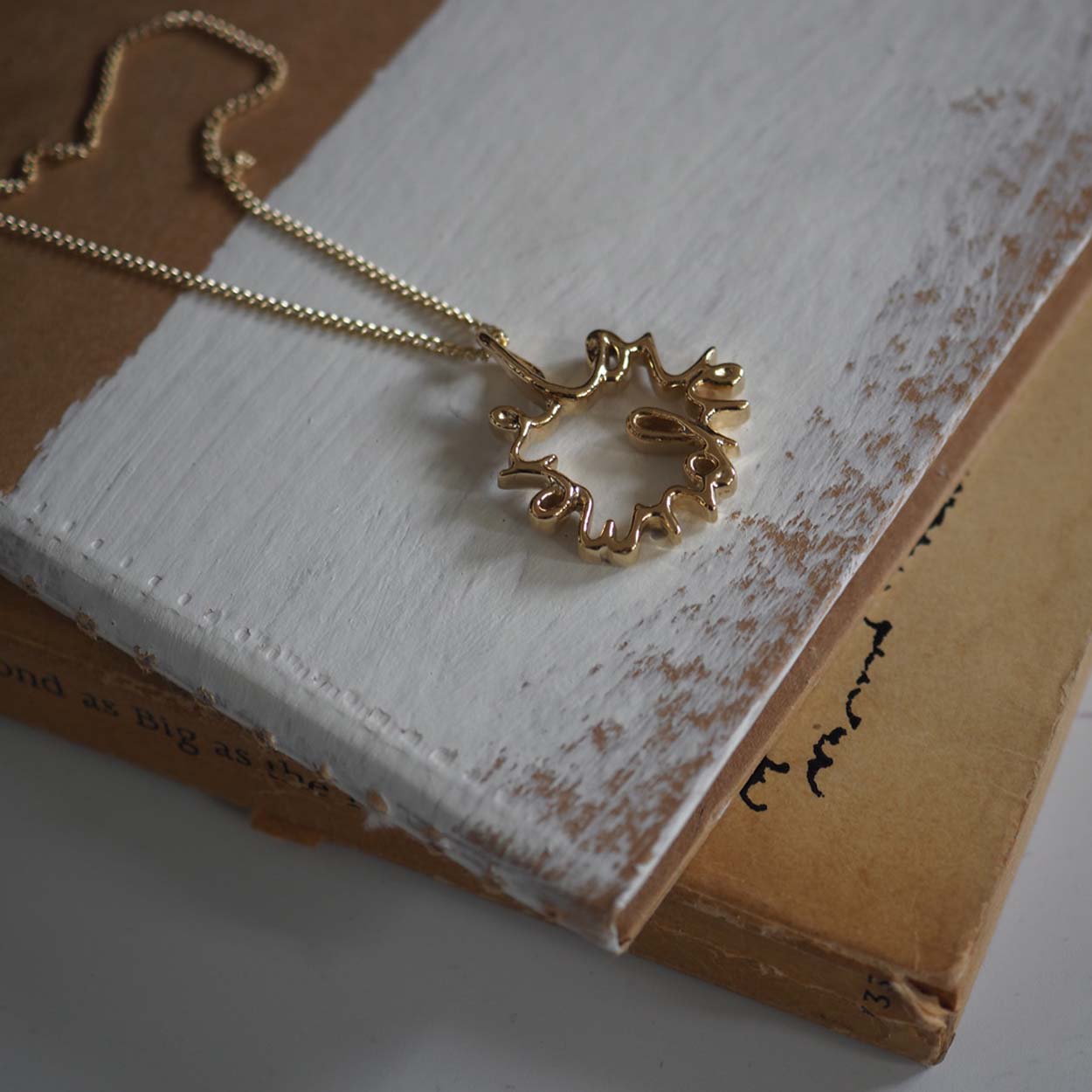 Love You More Petite Necklace in solid yellow, white, or rose gold — delicate gold pendant symbolising deep love and connection, handcrafted in London.