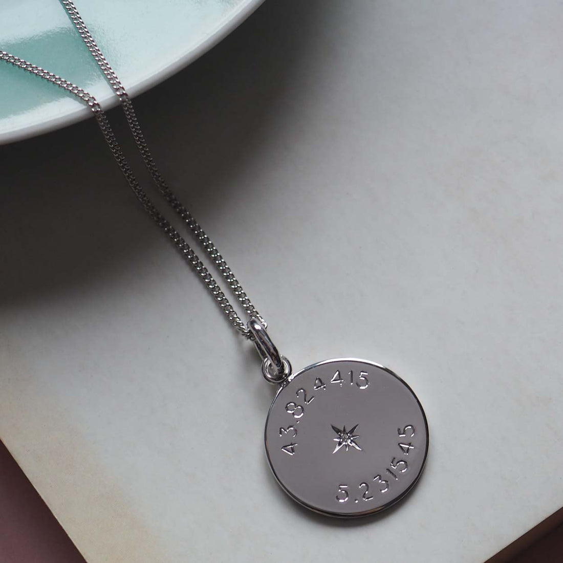 Sterling silver Diamond Latitude and Longitude Necklace with personalized coordinates, symbolizing celestial navigation and cherished memories