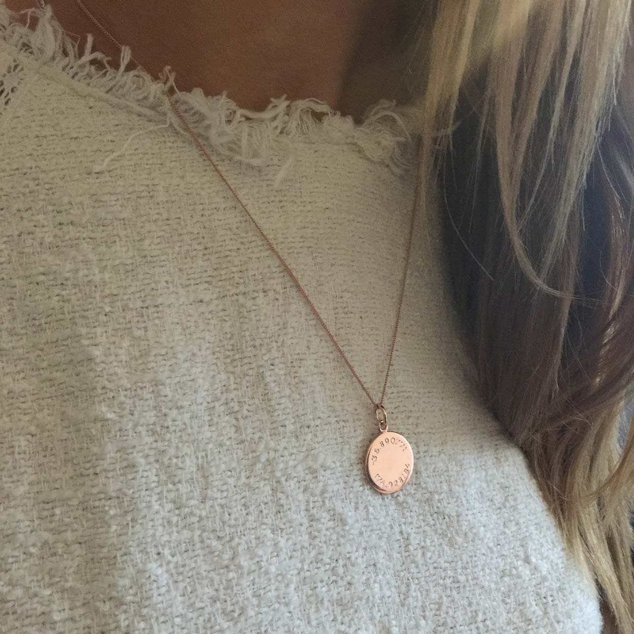 Latitude and Longitude Necklace in Solid Gold, hand-engraved with personalized coordinates. Inspired by ancient celestial navigation and crafted as a meaningful keepsake.