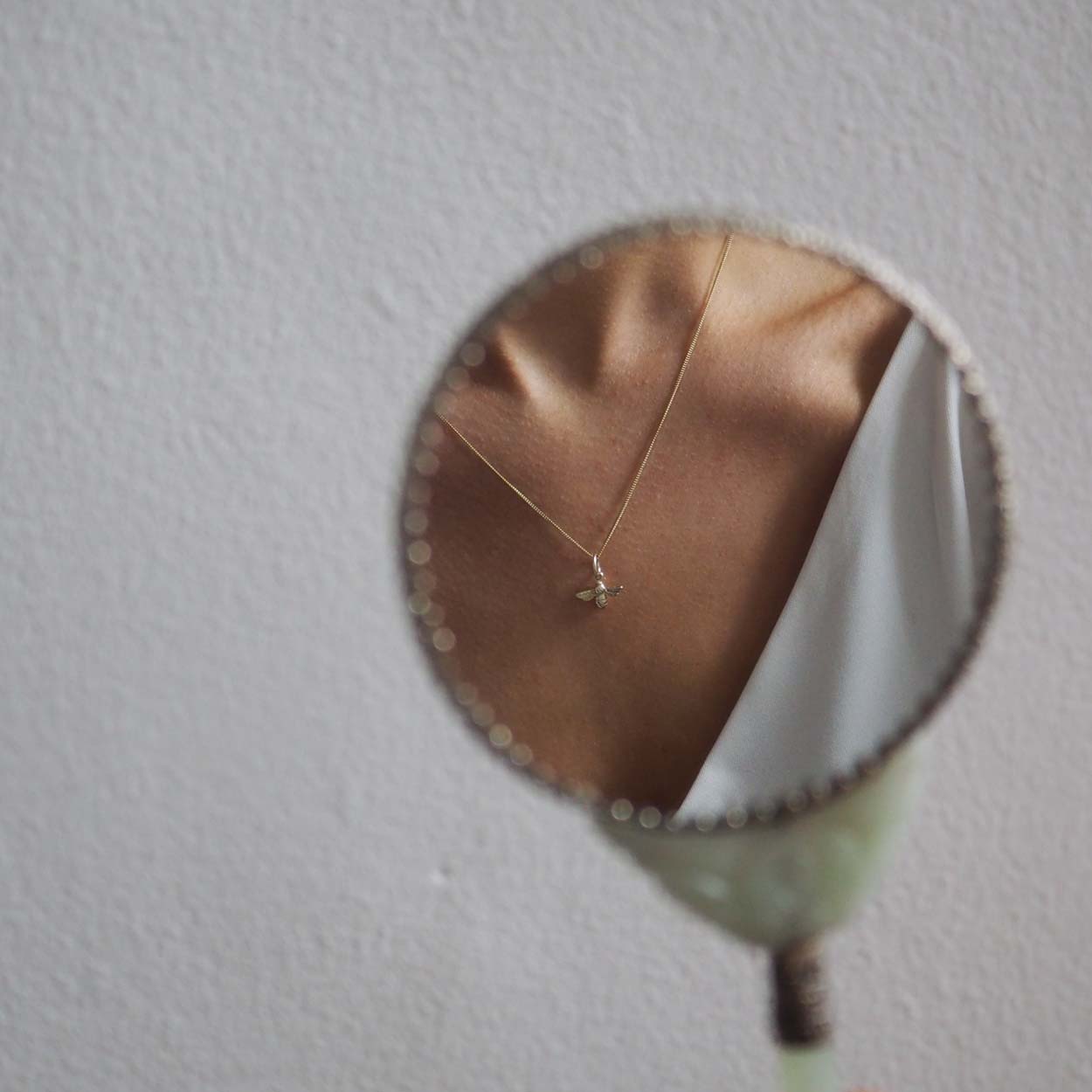 Solid gold bee necklace with a detailed bee charm, handcrafted in 9ct yellow, white, or rose gold. A symbolic pendant representing love and resilience.