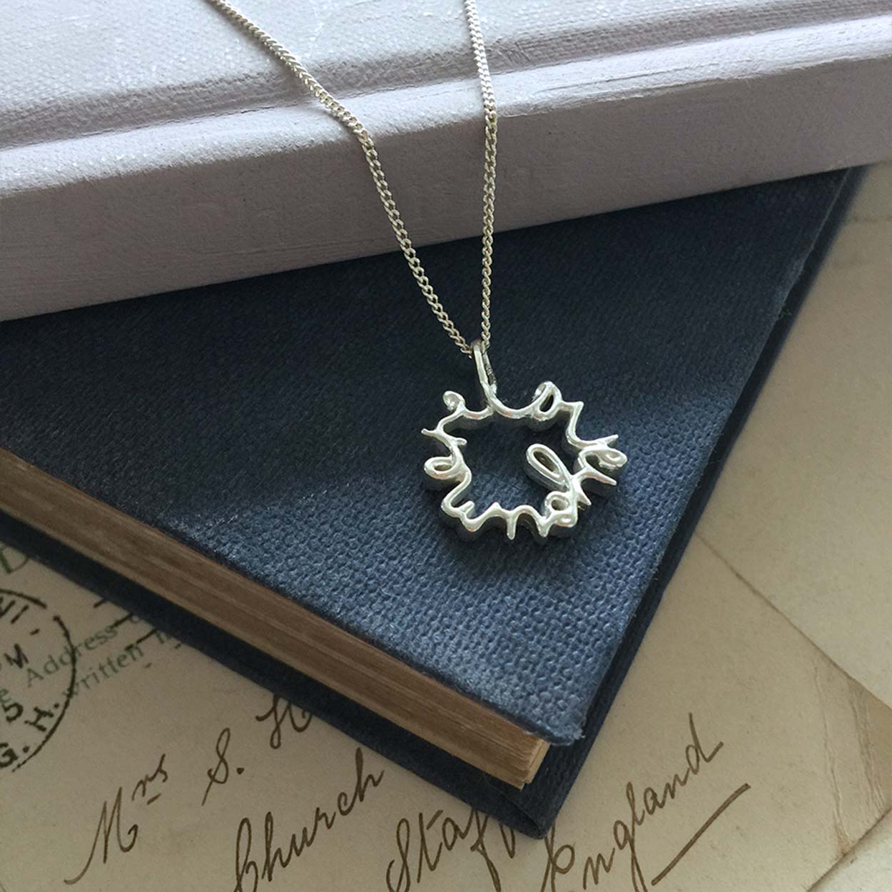 Love You More Petite Necklace in recycled sterling silver — delicate and symbolic, designed for everyday wear and layering.