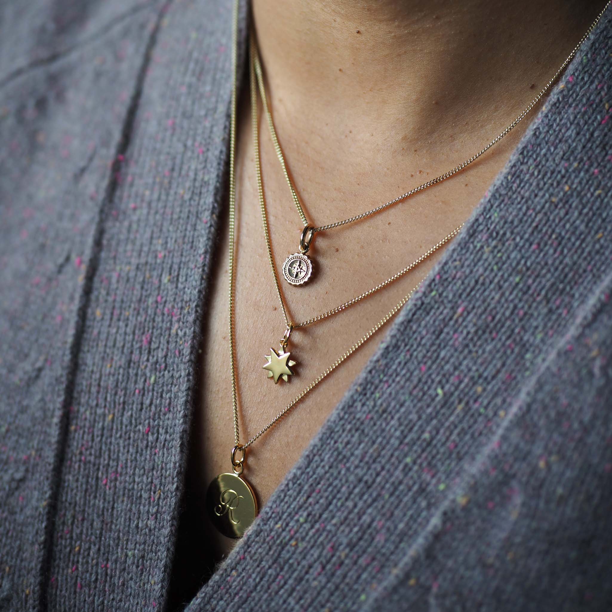 Celestial-inspired Starburst Necklace in solid silver or gold. Handmade in London, a timeless symbol of light, hope, and quiet strength.