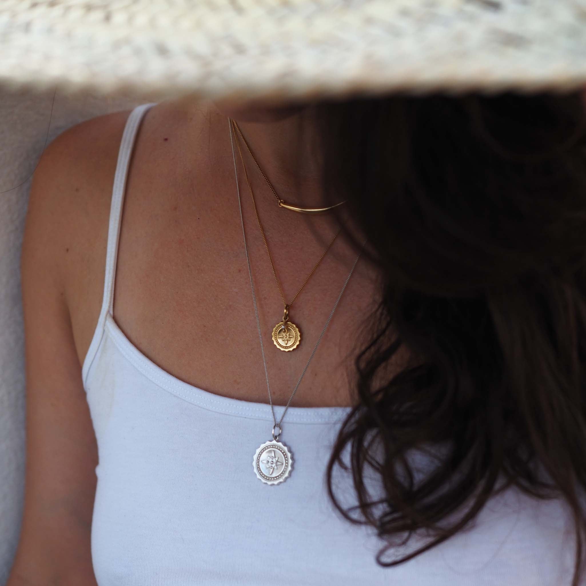 Curved sterling silver bar necklace with Forever Strong engraving, handmade jewellery inspired by strength.