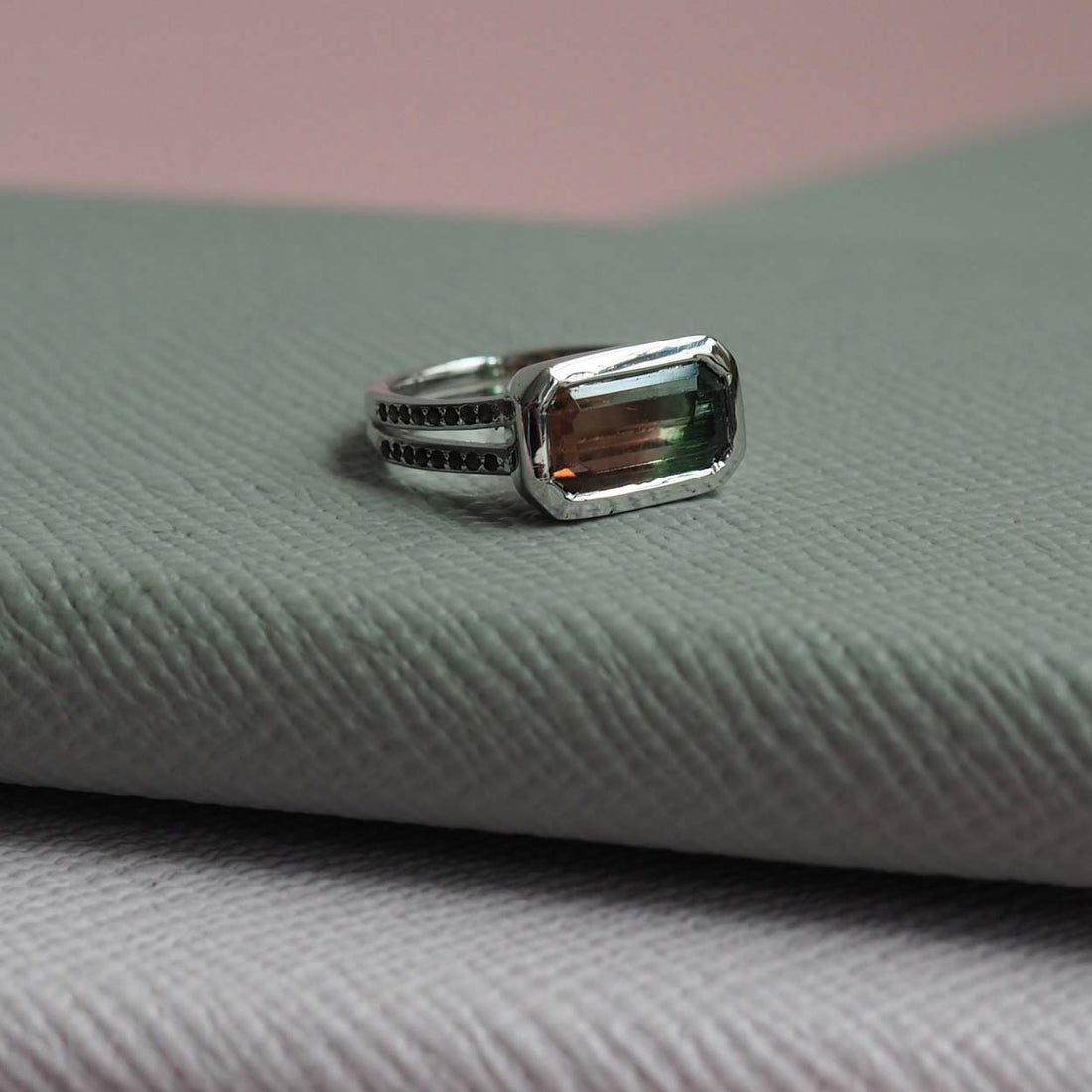 Bianca Jones Watermelon Tourmaline Engagement Ring in Recycled White Gold with Green Tourmaline Accents and Rub-Over Setting