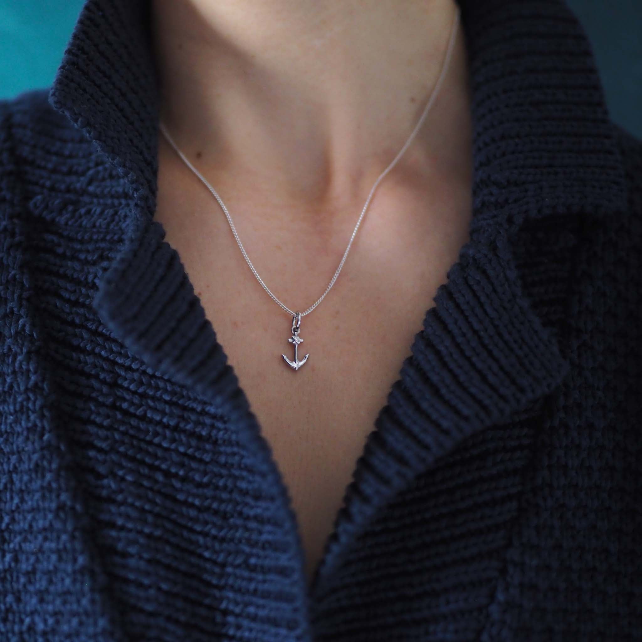 Silver anchor necklace symbolising strength and hope, handmade in London.