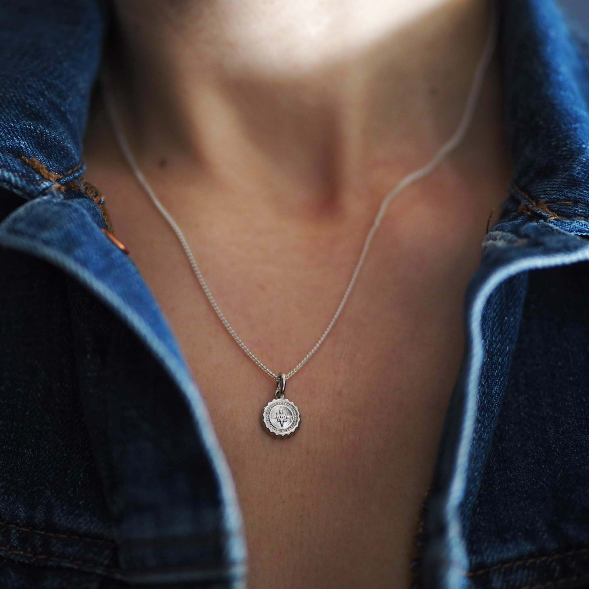 Model wearing Silver Compass Mini Necklace on 18 inch chain