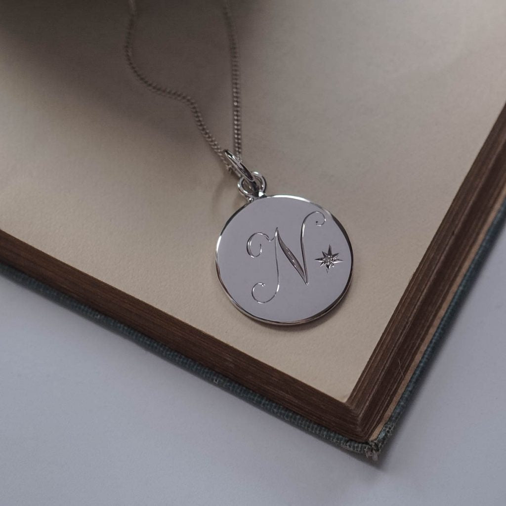Silver Diamond Initial Necklace with hand-engraved letter and star-set diamond. Handmade in London in solid sterling silver.
