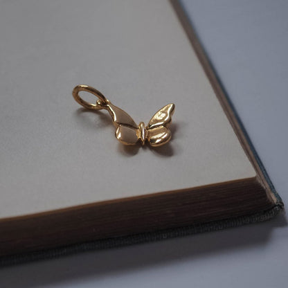 Bianca Jones handmade solid 9ct gold butterfly charm in rose, white, or yellow gold, featuring intricate detailing.