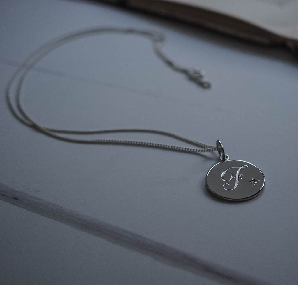 Silver Diamond Initial Necklace with hand-engraved letter and star-set diamond. Handmade in London in solid sterling silver.