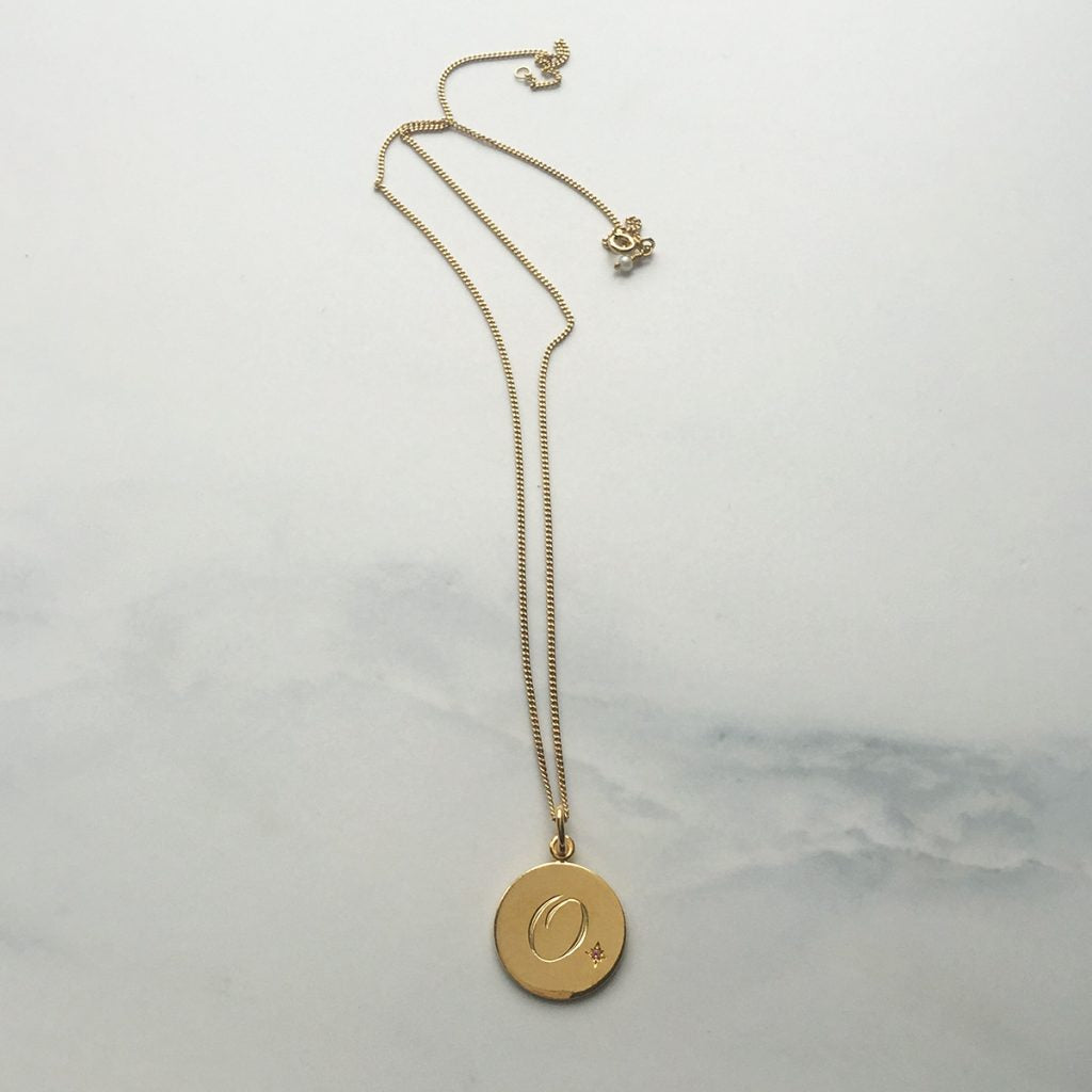 Solid 18ct gold vermeil Birthstone October Pink Tourmaline Initial Necklace with a hand-engraved scrolled initial and a brilliant-cut Pink Tourmaline in a Victoriana star-style setting, symbolising love, balance, and seasonal elegance.