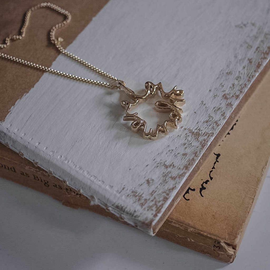 Love You More Petite Necklace in solid yellow, white, or rose gold — delicate gold pendant symbolising deep love and connection, handcrafted in London.