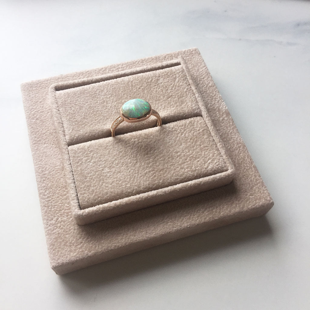 Bianca Jones bespoke opal rose gold ring with diamonds, radiating a blend of timeless romance and luxury