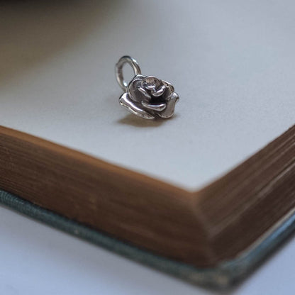 Handmade solid rose charm available in white, yellow, and rose gold, showcasing exquisite craftsmanship and detail