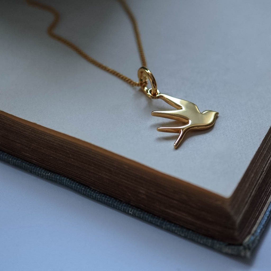 Bianca Jones flat, highly polished swallow necklace in sterling silver or gold vermeil, symbolising freedom and hope