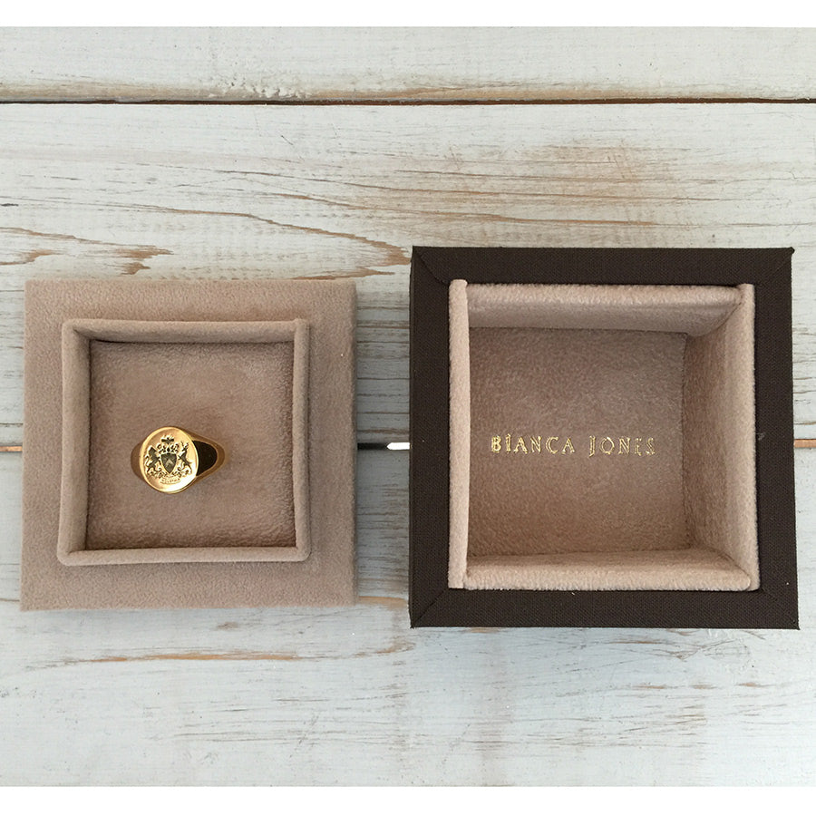 Fettesian Signet Ring shown in packaging