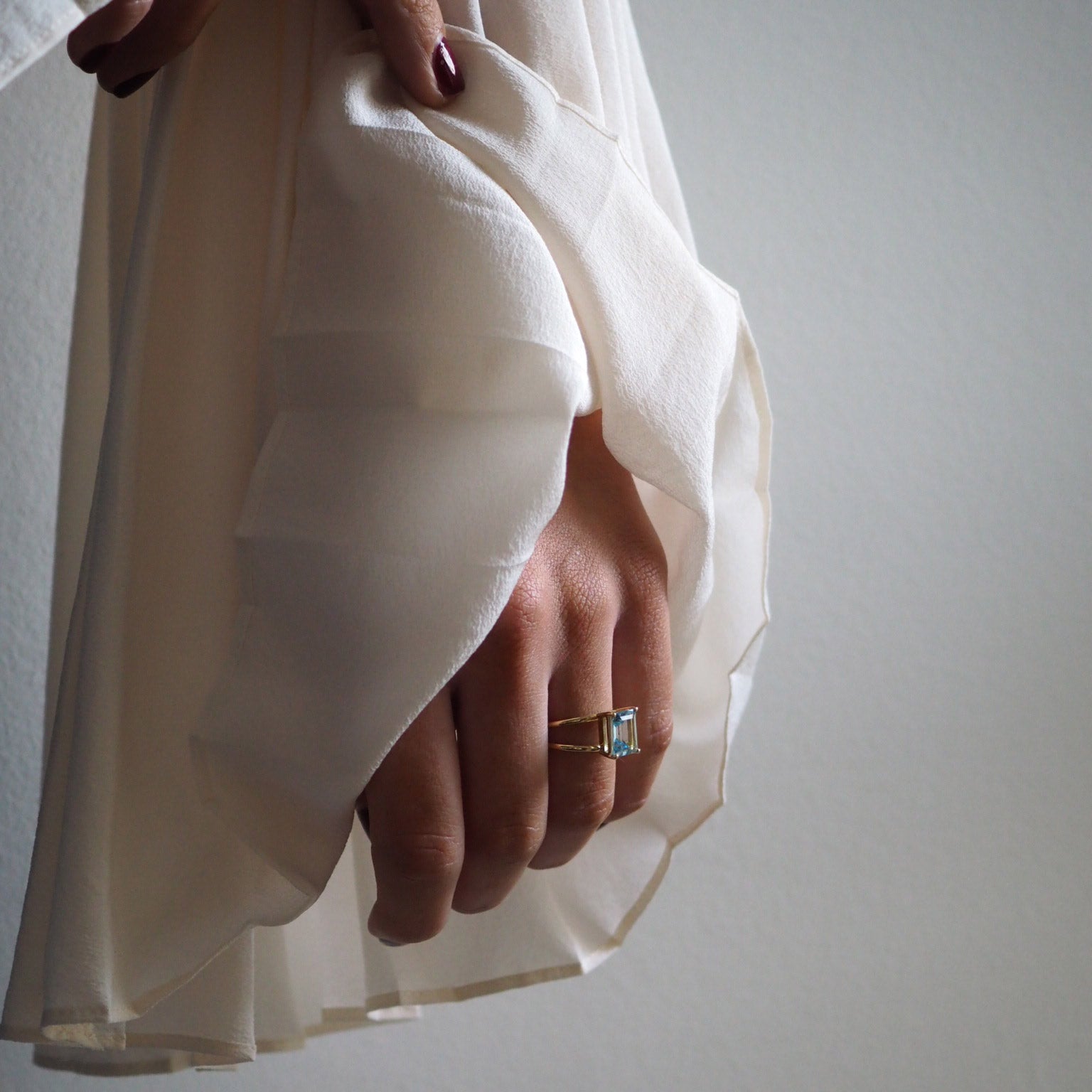 Emerald-Cut Aquamarine Ring by Bianca Jones Jewellery, London: Joyful aquamarine set on two handcrafted yellow gold bands.