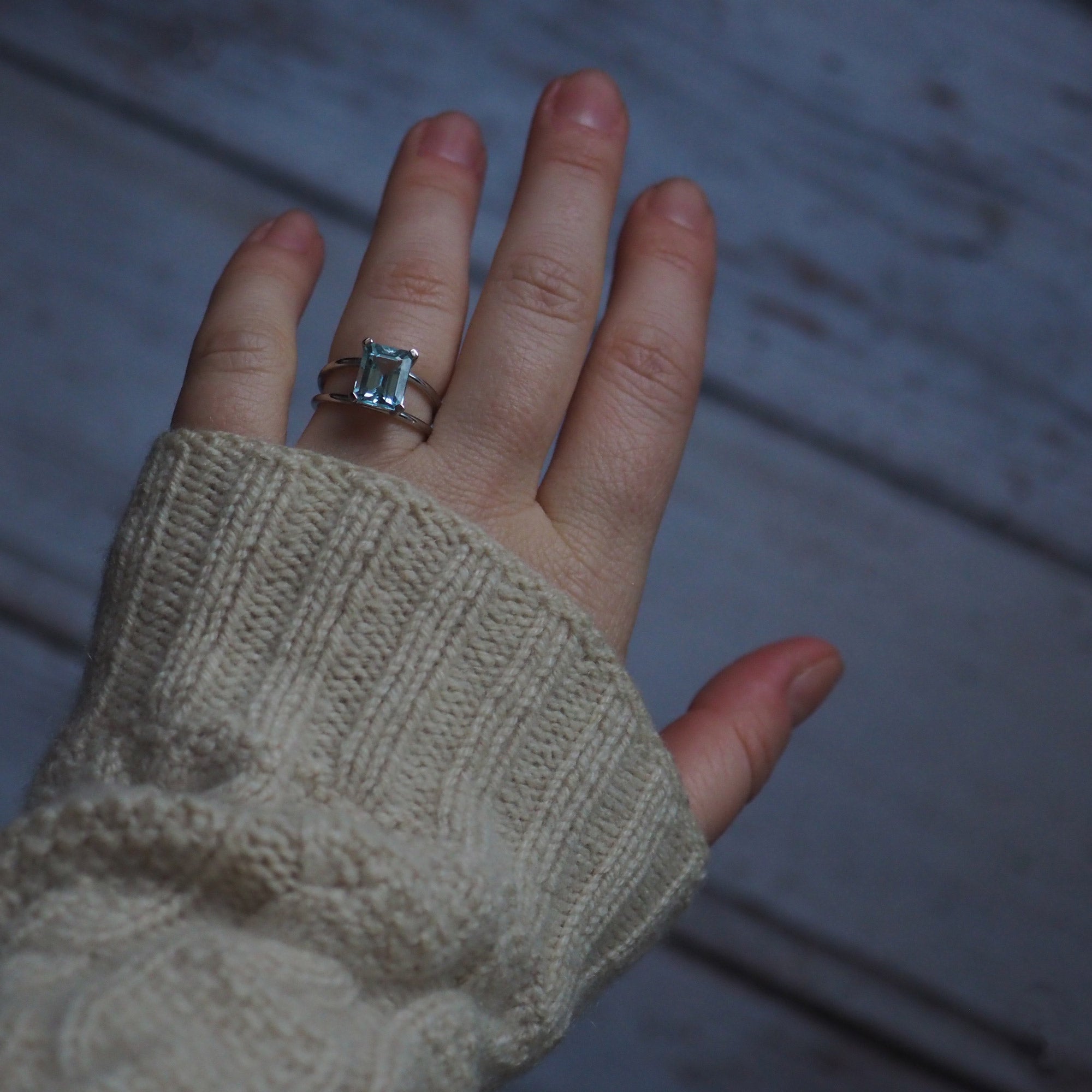 London-crafted Bridal Emerald-Cut Aquamarine Ring by Bianca Jones Jewellery, set on twin white gold bands.