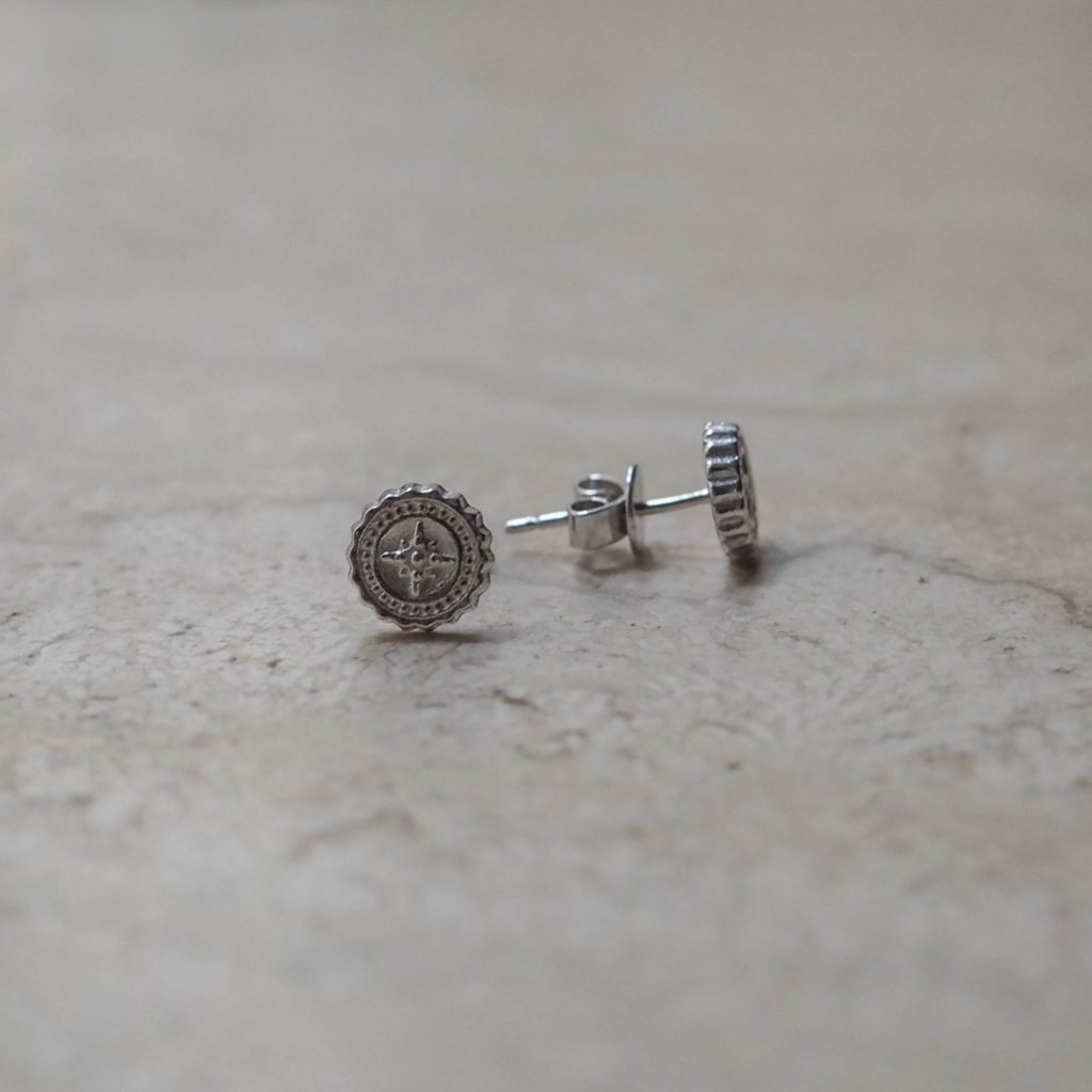 Compass Stud Earrings, symbolising guidance and protection, perfect for those embarking on new journeys. A stylish accessory for explorers and adventurers.