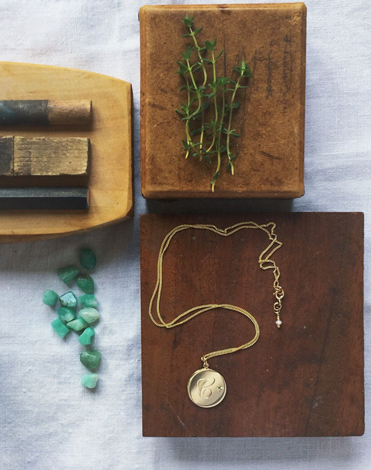 Birthstone Initial Necklace by Bianca Jones, hand-engraved and adorned with a precious gemstone in a Victoriana style setting