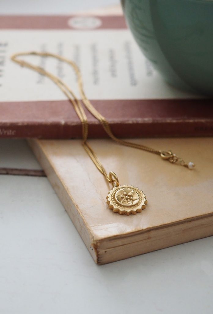 Close-up of the Compass Necklace by Bianca Jones, symbolising guidance, protection, and the pursuit of dreams