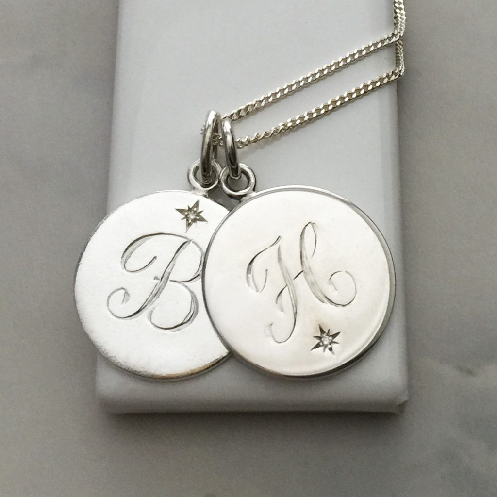 Close-up of the Diamond Initial Necklace by Bianca Jones, featuring a hand-engraved initial and a brilliant-cut diamond, perfect for gifting to your mum.