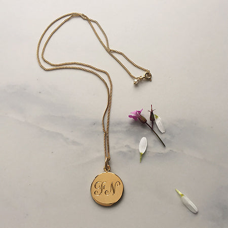 Detail of the Double Initial Necklace in 18ct Yellow Gold Vermeil, showcasing personalised initials entwined together.