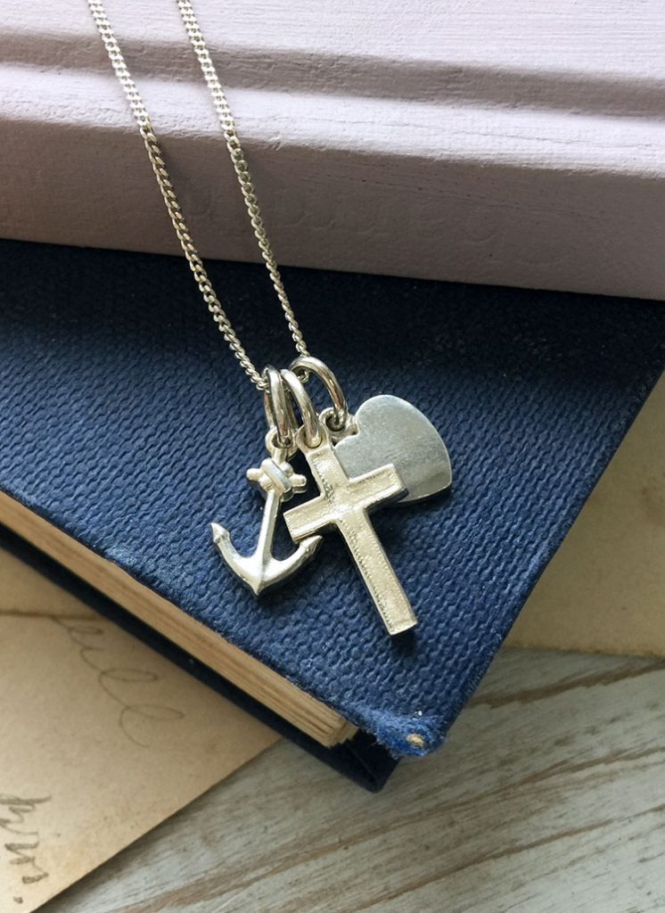 Faith, Hope, and Charity Necklace by Bianca Jones Jewellery featuring a delicate belcher chain with Cross, Anchor, and Love Heart charms in yellow gold, rose gold, or sterling silver.