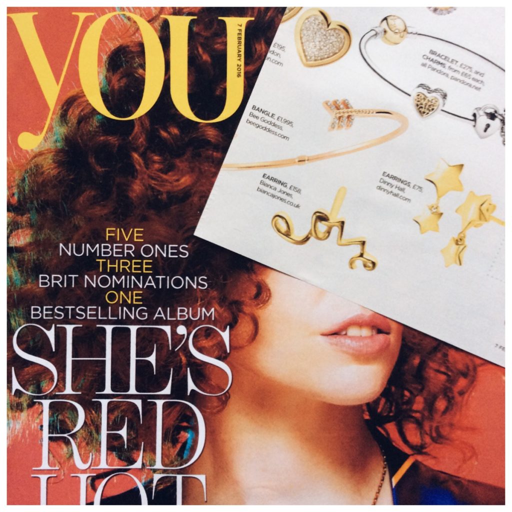 Solid Yellow Gold 'Love' stud earrings, perfect for Valentine's Day, featured in YOU Magazine