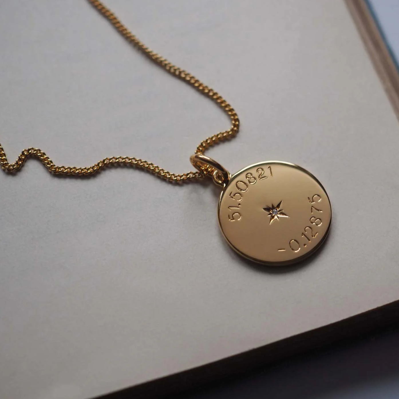 Lauren and her best friends wearing their Latitude and Longitude Necklaces, each engraved with the coordinates of the place where they first met.