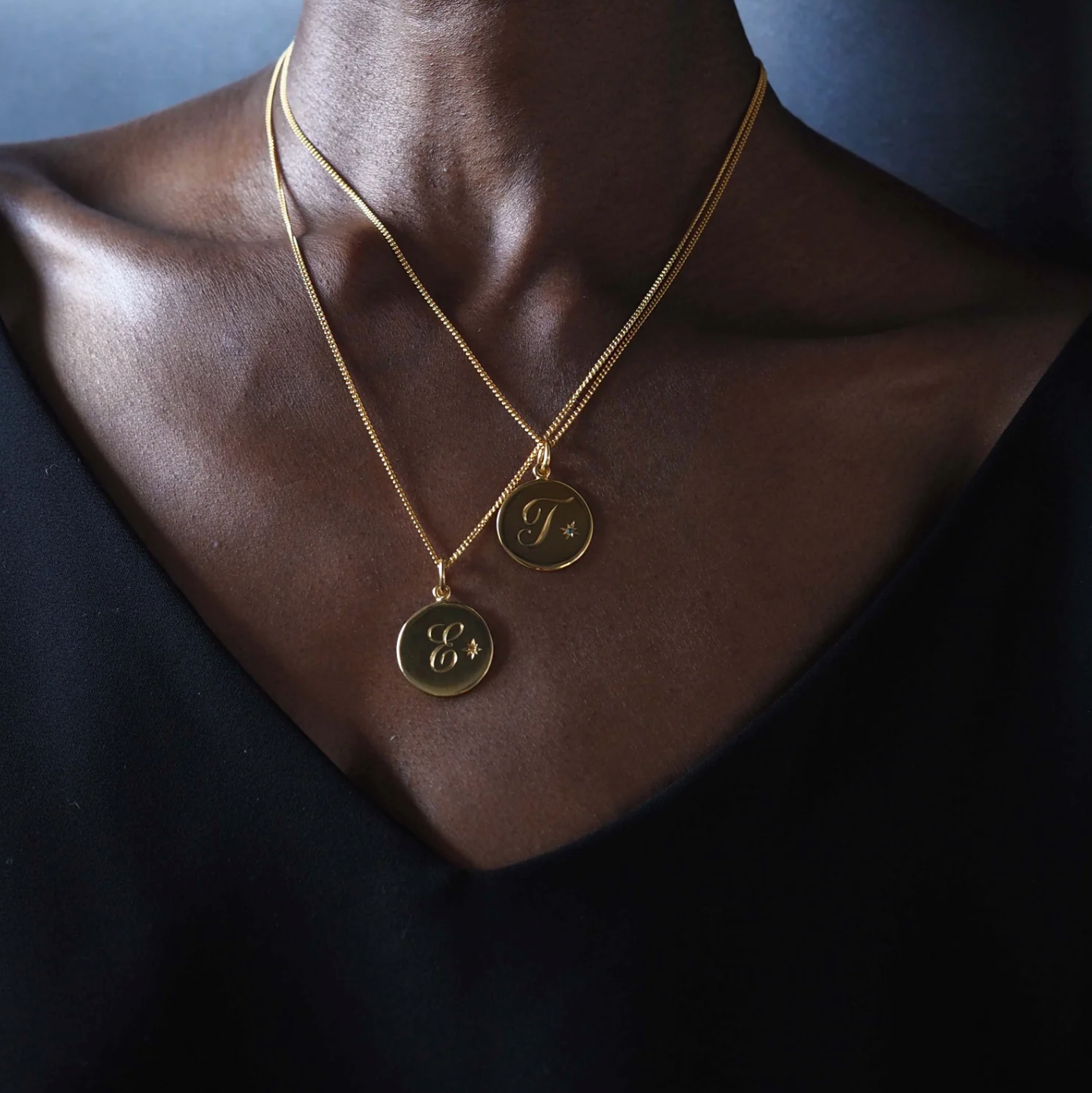 Close-up of the Citrine Initial Necklace by Bianca Jones, featuring a hand-engraved initial and a vibrant Citrine gemstone