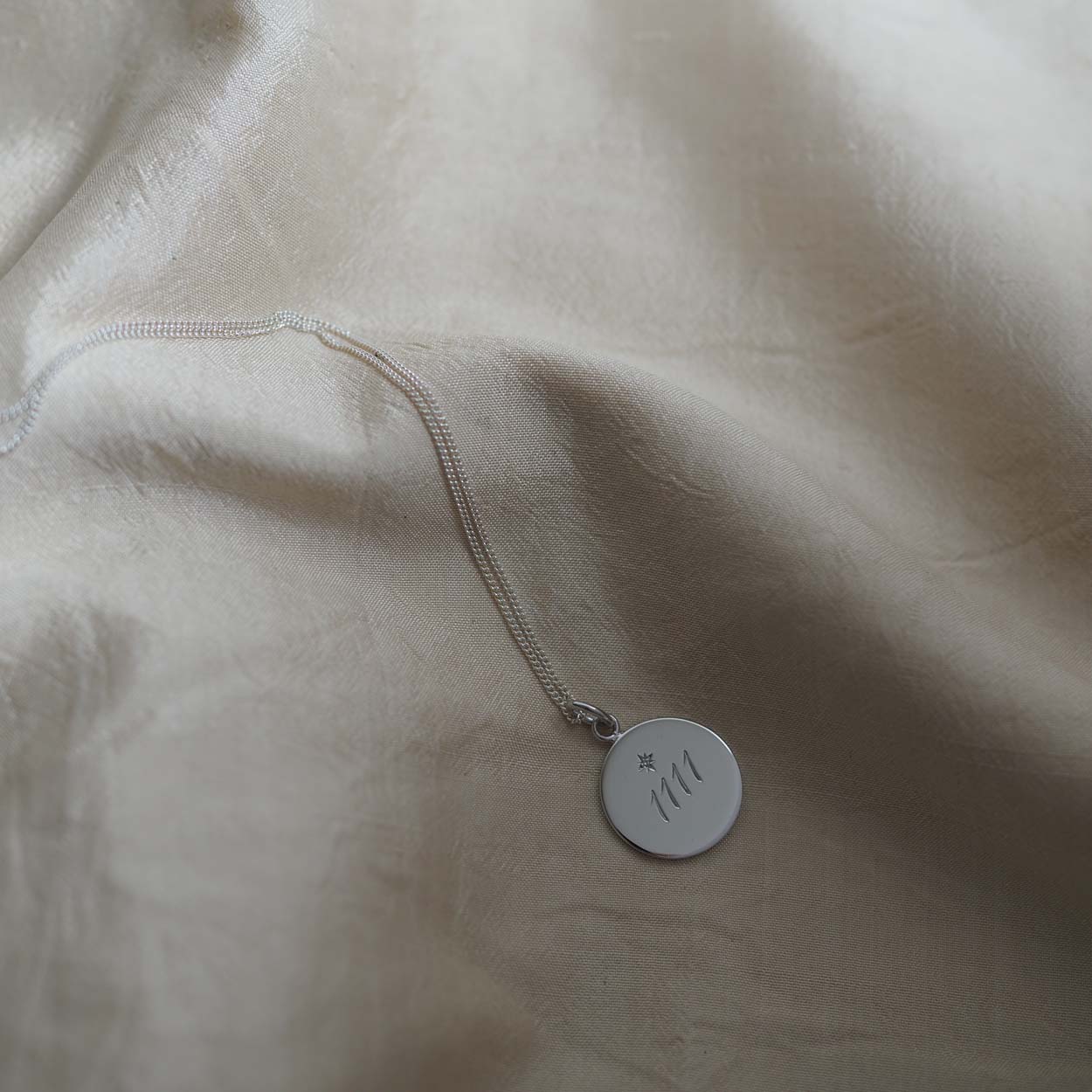 Silver 1111 necklace with engraved numerals, symbol of manifestation and intuition