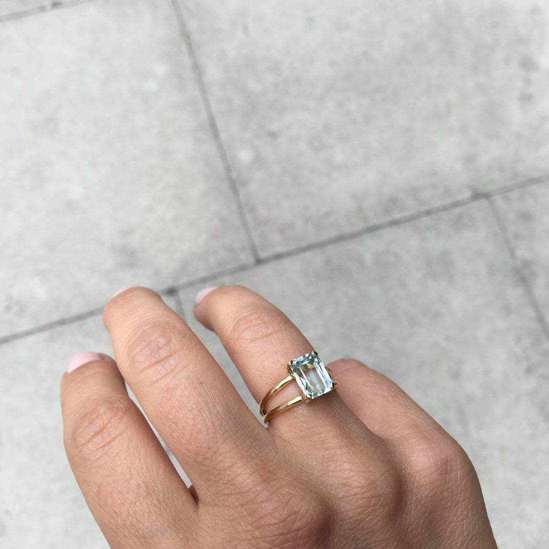 Bridal Emerald-Cut Aquamarine Ring by Bianca Jones Jewellery, London: Joyful aquamarine set on two handcrafted yellow gold bands.