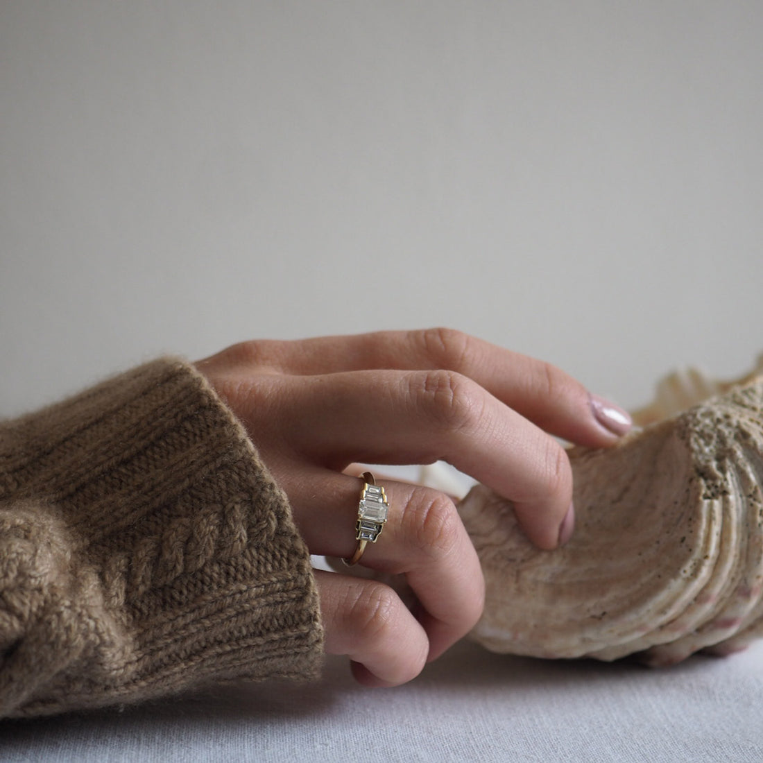 Bianca Jones Art Deco Vintage Diamond Engagement Ring in Recycled Yellow Gold with Emerald-Cut Diamond, Baguette Accents, and Secret Heart Detail.