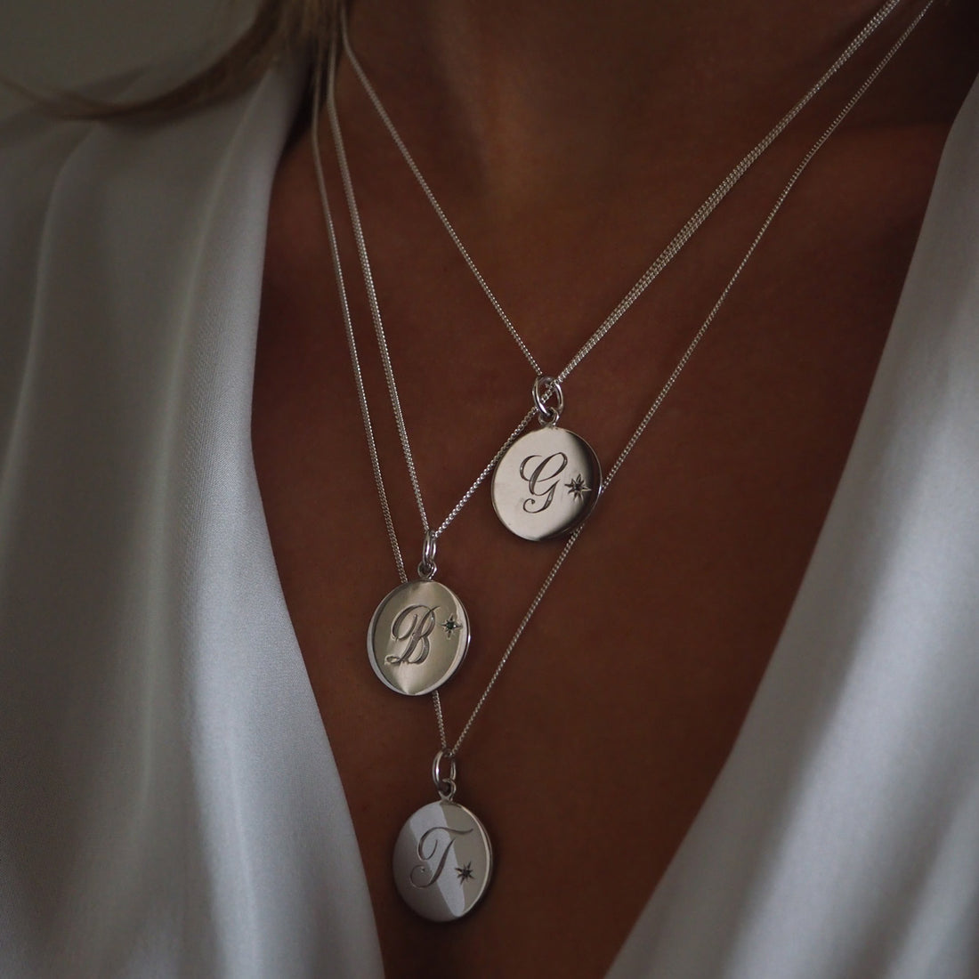 Birthstone August Peridot Initial Necklace with a hand-engraved initial, featuring a sparkling Peridot, set in a design inspired by the grand Victoriana era, symbolising radiant happiness and protective strength.