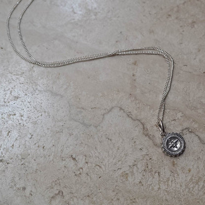 Bianca Jones compass baby necklace available in sterling silver or gold vermeil, symbolising guidance and adventure for explorers.
